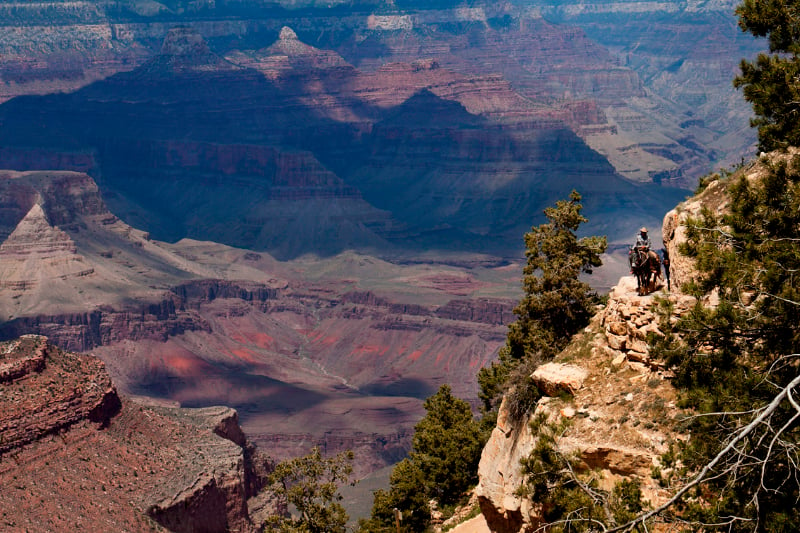 A dark shadow sweeps across the Grand Canyon.